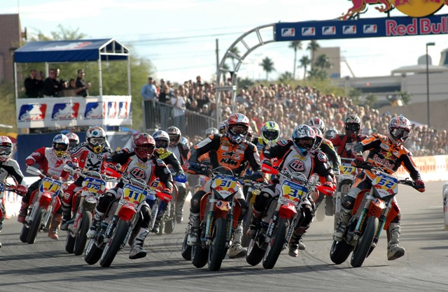 The field gets underway at the start of the AMA Red Bull Supermoto A-Go-Go in Las Vegas on Nov. 13, 2004. Jeff Ward, on the No. 3x Honda, won the race over Jurgen Kunzel (riding the No. 52 KTM) and clinched the 2004 AMA Supermoto Championship. (Larry Lawrence photo)