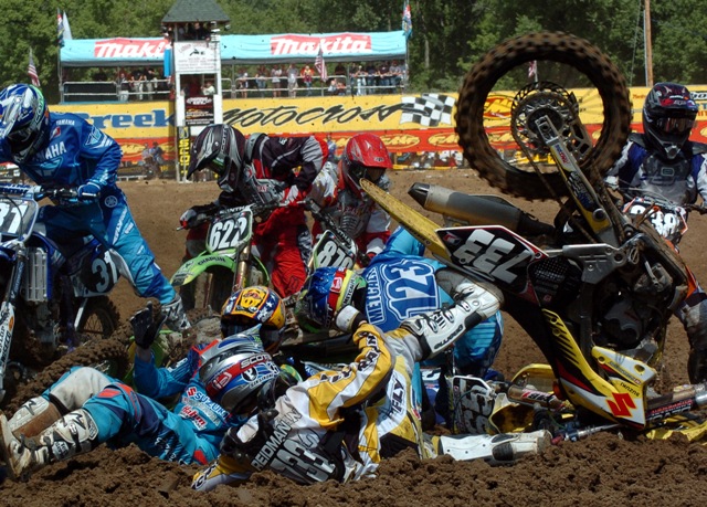 Tanner Reidman (733), of Bismarck, N.D., Brett Metcalfe (123), of Australia, and Ryan Sipes (yellow helmet), of Vine Grove, Ky., were among a group of riders to go down in a pileup crash in the first turn of the 2005 AMA 125cc Motocross Championship round in Millville, Minn. None of the riders suffered major injuries in the crash. Reidman, Metcalfe and Sipes all re-entered the race. (Larry Lawrence photo)