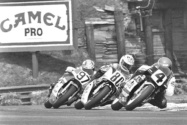 Renfrow, Kocinski, Carter - Mid-Ohio '87 John Kocinski, on the Roberts/Team Nordica No. 80 Yamaha, doing battle with Vance & Hines Honda’s Randy Renfrow (4) and MacLean Racing Honda’s Alan Carter (97) at the Mid-Ohio 250 Grand Prix on August 2, 1987. Kocinski went on to win the race over Donny Greene and Renfrow. Carter finished fifth. (Larry Lawrence photo)
