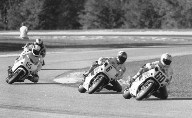 Hall - Smith - Harth - Roebling This is Roebling Road, maybe 1990, Kurt Hall (60) leading Valvoline Suzuki teammate Mike Smith and coming up fast is Mike Harth (65) on a bike he borrowed from a novice racer on the spur of the moment. Harth went on to win the race, but about 15 minutes after this photo was taken all hell broke loose in the pits. Someday soon I’ll tell the story of just what happened. It’s a doozy. (Larry Lawrence photo)