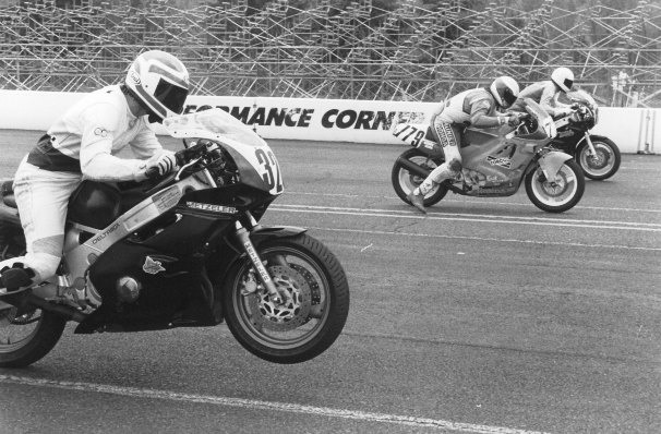 Honcoop, Brian - SIR 1991 Brian Honcoop (nearest camera) wheelied his Yamaha off the line at the start of a WERA race at Seattle International Raceway in June of 1991. Brian Honcoop (on the far side of the track) went on to win the race. (Larry Lawrence photo)