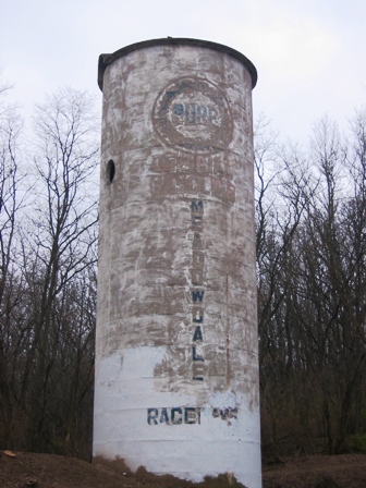 Meadowdale 1 One of the iconic landmarks of Meadowdale was its Pure Gasoline grain silo located near one of the main entrances to the track. In 2006 you could barely read the sponsorship logo on the weathered old silo. (Larry Lawrence photo)