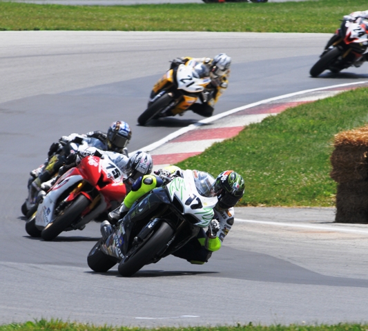 James Rispoli (17) leads Huntley Nash (75), Joey Pascarella, Elena Myers (21) and Travis Wyman (24) in an AMA Pro SuperSport race at Mid-Ohio Sports Car Course in July of 2010. (Larry Lawrence photo)