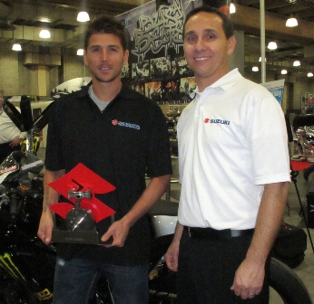 CARDENAS_BORT_AWARD-sm American Suzuki’s Senior Communications Manager, Steve Bortolamedi presented Martin Cardenas with a custom, hand-built award commemorating the 2010 Daytona Sportbike Championship he claimed aboard his Suzuki GSX-R600. Cardenas will be stepping up for 2011 and campaigning an M4 Suzuki GSX-R1000 in the 2011 AMA Superbike Championship.