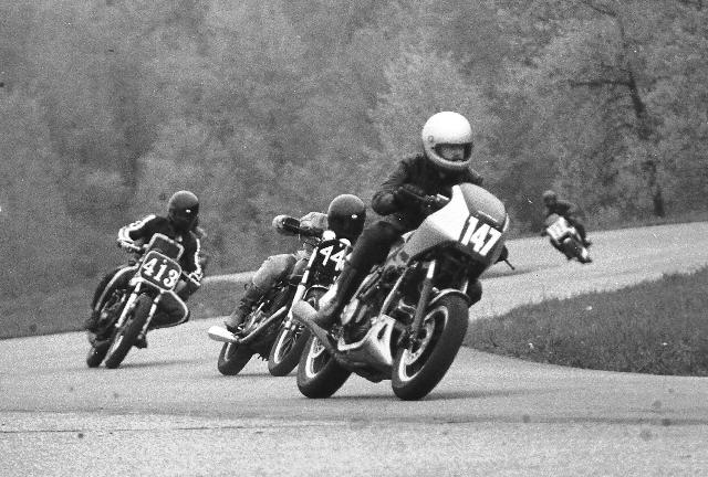 Tom Dollmeyer (147) on a Honda 500 Interceptor leads Keith Truesdell and Larry Cohee (413) in a WERA sprint race at Grattan Raceway in May of 1984. (Larry Lawrence photo)