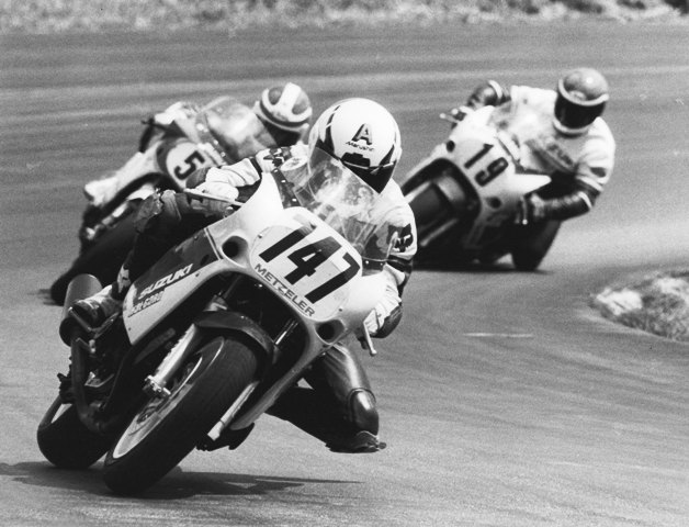 Fenwick - Suz - Grattan Andy Fenwick leads Ray Yoder and another rider in WERA sprint action at Grattan Raceway circa 1987. The trio is chasing Suzuki GSXR contingency dollars, abundant in the mid-to-late 1980s. (Larry Lawrence photo)
