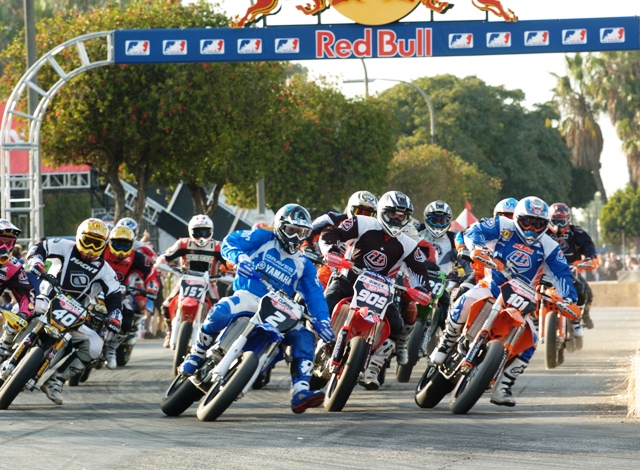 Long Beach Lites - 2006 The AMA Supermoto Lites race gets underway on the Queen Mary dock in November of 2006, in Long Beach, Calif. David Pingree (No. 101 Red Baron KTM) has the inside line over Dalton Dimick (No. 909 TLD Honda), Brandon Currie (No. 2 Graves Motorsports Yamaha) and Dan Casey (No. 40 Mach 1 Yamaha). Pingree broke through to win his first AMA Supermoto national that day on the docks. (Larry Lawrence photo)