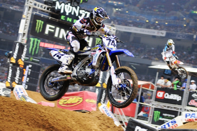 Stroupe - St. Louis 2011 Austin Stroupe jumps his Valli Motorsports/Rockstar Yamaha during the final of the St. Louis Supercross Saturday night. You can see Chad Reed jumping his bike on another section of the track in the background. Stroupe is coming back from injury and getting stronger every week. He said right now Supercross is a bonus for him as he gets ready for the outdoor nationals. (Larry Lawrence photo)