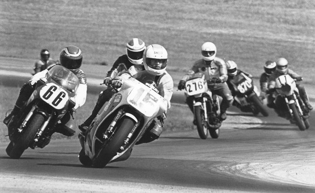 Team Gamma - Grattan WERA National Endurance competition at Grattan Raceway in the mid-1980s. Pictured is Team Gamma’s rider is tiptoeing through a left-hand with the rear end of the bike squatting because of the broken shock on the team’s Suzuki RG500. (Larry Lawrence photo)