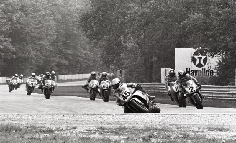 Road America SB '93 Colin Edwards (No. 45) leads the field early in the AMA Superbike race at Road America in Elkhart Lake, Wisconsin. Following Edwards is his Vance & Hines Yamaha teammate Jamie James (No. 2), Muzzy Kawasaki riders Miguel Duhamel (No. 17) and Tiger Sohwa (No. 60), Mike Smith on the No. 68 Camel Honda, the No. 21 Ferracci Ducati of Pascal Picotte, Dale Quarterely, Thomas Stevens on the No. 11 Yoshimura Suzuki, Doug Polen (No. 23 Ferracci Ducati) and Steve Crevier (No. 14 McBride Kawasaki). . (Larry Lawrence photo)