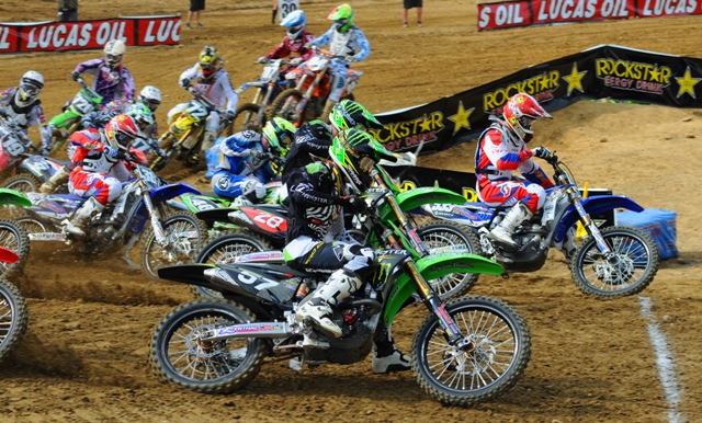 Audette, Gannon - Budds Creek '11 Rookie pro Gannon Audette (red, white and Blue riding gear) nails the holeshot on the inside during moto two fo the Lucas Oil AMA Pro 250 Motocross race at Budds Creek this past Saturday. Audette, who hails from Minneapolis, went on to finish 12th overall. (Larry Lawrence photo)