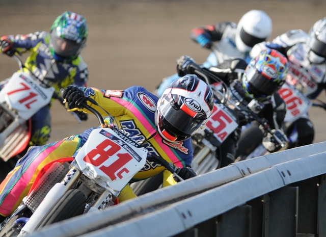 Pro Singles standout Zakk Palmer shows exactly what riding the rail means during a run at the Springfield Mile. Behind Palmer in this photo you can also see Shayna Texter (25A), Robert Treinen (71L), Cody Johncox (96B) and Adam Bushman (in the back of the pack with white helmet). Palmer used this riding style to win the Pro singles division on the Springfield Mile on Sunday. (Larry Lawrence photo)