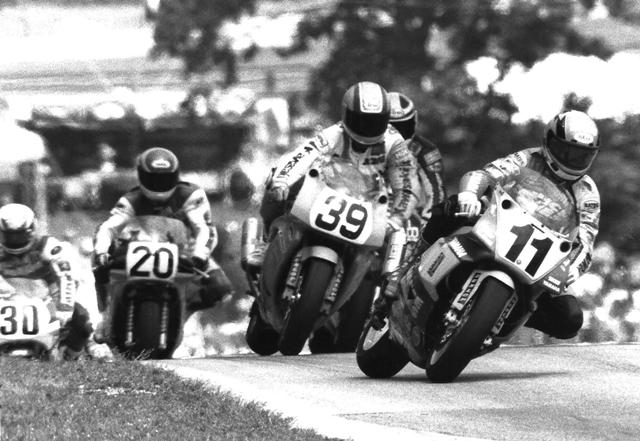 Stevens - Elkhart '91 Thomas Stevens leading a pack in the ’91 Road America Superbike race. Stevens, on the Vance & Hines Yamaha, leads Muzzy Kawasaki’s Jacques Guenette (39), Two Brother Honda’s Freddie Spencer (tucked in behind Guenette), Commonwealth Honda’s Rich Arnaiz (20) and Yoshimura Suzuki’s Tommy Lynch (30). (Larry Lawrence photo)