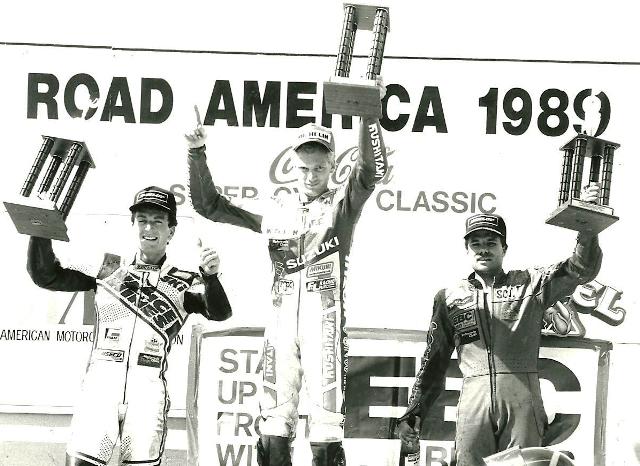 Scott Russell stands atop the podium after winning the AMA 750 Supersport at Road America in June of 1989. It was a Suzuki sweep that weekend in Elkhart Lake, Wisconsin. Russell is joined on the podium by second-place David Sadowski and hometown hero Scott Zampach, who took third. (Larry Lawrence photo)