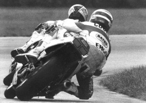Hall - Cooley - IRP Oct. '91 Team Suzuki Endurance racer Kurt Hall leads Team Ace Racing’s Wes Cooley through the carousel at Indianapolis Raceway Park in October of 1991 during a WERA National Endurance race. The teams, both running under the Valvoline Suzuki tent, finished first and second. Note the nearly identical riding position of both riders. (Larry Lawrence photo)
