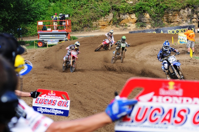 A quartet of riders race across the Mechanics’ Area during the Lucas Oil AMA Pro Motocross Championship Saturday at Millville, Minnesota. Ryan Sipes (No. 25), Travis Baker No. 58), Blake Baggett (No. 57) and Cole Seely (No. 36) take a quick glance at their boards during moto two of the 250 Motocross event. (Larry Lawrence photo)