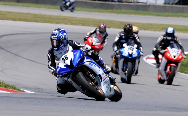 Corey Hart, of Royston, Ga., races his Yamaha R6 in front of Michigan rider Brian VanDenBrouck, Justin Neyra of Cincinnati, and Aaron Bagwell of Burt, Mich., in the latter stages of the Sunday AMA Pro SuperSport East race at Mid-Ohio Sports Car Course on July 10, 2011. Hart had two top-20 finishes in Supersport this season. The question is does Hart wear sunglasses at night? Thankfully for Corey, he was probably born after his namesake had his big pop hit in 1984. (Larry Lawrence photo)