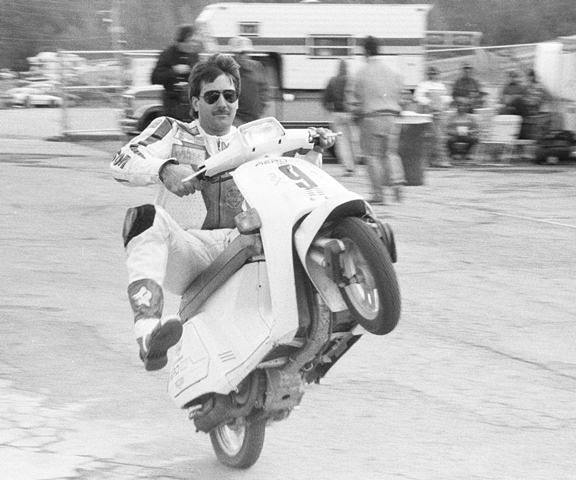 Bougas - GNF '88 Mark Bougas wheelies his pit bike at Road Atlanta during the 1988 WERA Grand National Finals. Bougas was there racing the Suzuki GSXR Cup Finals. Mark had a relatively short pro racing career, but there were some significant highlights. (Larry Lawrence photo)