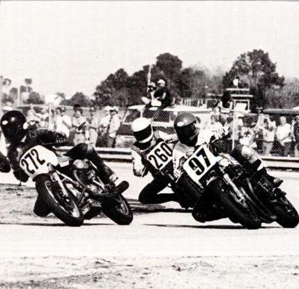 Pierce - Daytona '79 Ron Pierce (No. 97) goes around the outside of Moto Guzzi racer Ian Day (No. 272) with Gary Tompkins (No. 260 Kawasaki) looking on in the 1979 Bell Superbike 100 at Daytona International Speedway. Pierce won the race leading a Yoshimura Suzuki sweep of the race.