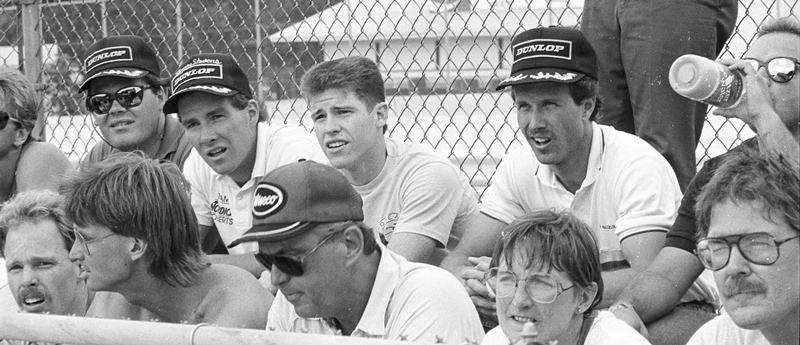 Rd Am riders meeting '88 Riders listen during a riders meeting at the AMA National Road Race at Road America in 1988. On the top row are Thomas Stevens (leaning forward with black hat and white shirt) and John Kocinski, who were teammates at the time on the Team Nordica Roberts AMA 250 Grand Prix squad. Next to Kocinski is Doug Polen. On the lower row you can see Doug Brauneck on the far left. Next to him is Dale Quarterley. (Larry Lawrence photo)
