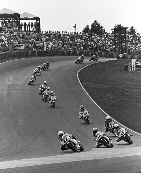 Salaverria - Mid-O '90 Al Salaverria leads Doug Brauneck (No. 46), Jon Cornwell (No. 49), Darrell Cooney (No. 70) and the rest of the field early in the AMA 250 Grand Prix race at Mid-Ohio Sports Car Course on Aug. 5, 1990. Salaverria went on to win the race in a tight battle over Brauneck and Cornwell. Also visible in the photo are Mike Sullivan (No. 74), Tom Paris (No. 13), Steve Crevier (No. 73), Donny Greene (No. 3), Lee Shierts (No. 85), Martin Miller (No. 98), Rick Tripodi (No. 44), William Himmelsbach (No. 94) and Robbie Petersen (No. 16). (Larry Lawrence photo)
