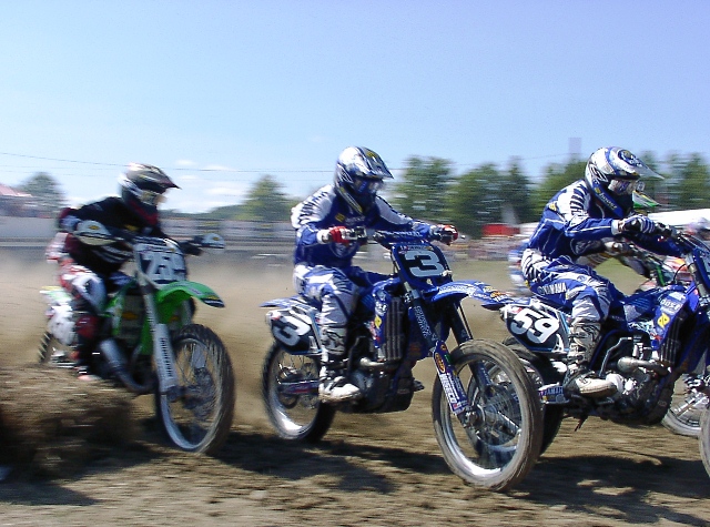 Boost Mobile Yamaha teammates Danny Smith (No. 59) and Mike Brown (No. 3) lead Kawasaki’s James Stewart (No. 259) at the start of a moto at the Binghamton 125cc National in 2004. (Larry Lawrence photo)