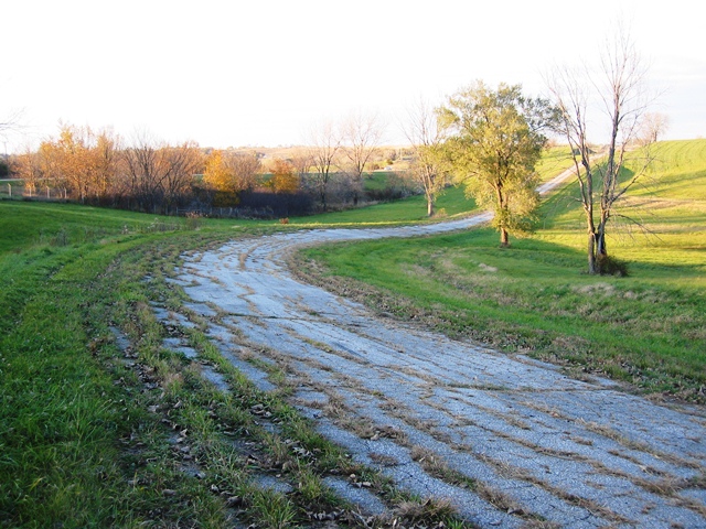 A view of the crumbling high-speed turn one at Greenwood Roadway. Riders who raced at Indianola report that the track was a wonderful layout, with a mix of sweeping and tight turns along with elevation changes. Unfortunately, like many road racing circuits of the 1960s, unforgiving guardrail lined many of the turns. (Larry Lawrence photo)
