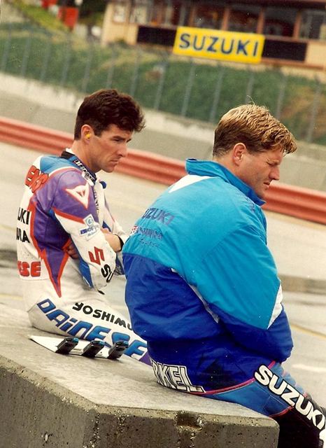 Stevens & Merkel - Laguna '95 Yoshimura Suzuki teammates Thomas Stevens (left) and Fred Merkel look on as they ready for Superbike practice at Laguna Seca at an AMA Superbike race in 1995. That year was a tough season for Yoshimura Suzuki. Stevens and Merkel, both former AMA Superbike champs, managed only a single podium apiece during the entire ’95 campaign. (Alan Sessarego photo)