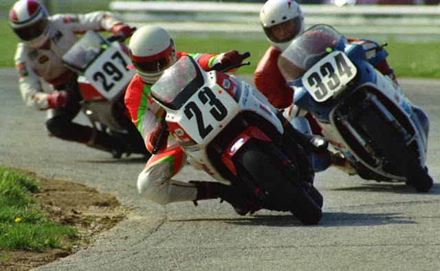 Horn, Chris - IRP April '86 Chris Horn (No. 23) leads Steve Landrey (No. 334) and Tom Darnell (No. 297) in a WERA A Superbike race at Indianapolis Raceway Park in April of 1986. This was early in the ’86 season and the Yamaha FZ750/Suzuki GSXR750 battles were at full song. (Greg Sickmeier photo)