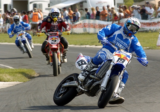 Henry - Waterford 2006 Doug Henry, of Torrington, Conn., slides his Yamaha into a turn ahead of Jeff Ward (No. 3) and Mark Burkhart in the second leg of the AMA Supermoto Championship on July 7, 2006 at Waterford Hills Road Race Course in Clarkston, Mich. Henry crashed in the first leg of the two-race event, but recovered to win the second race over Ward. (Larry Lawrence photo)