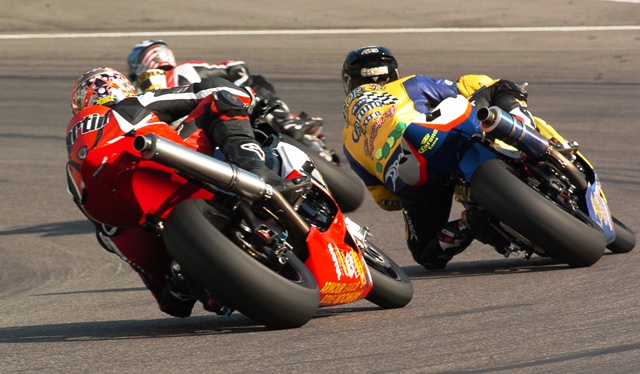 American Larry Pegram, who was racing the Hotbodies Racing/Trianglecycles.com Honda CBR1000RR runs ahead of Australian Brent George on his Corona Extra Suzuki GSXR1000 and Canadian Pascal Picotte on the Yamaha Canada Yamaha YZF-R1 in the Saturday AMA Superbike race at Barber Motorsports Park on April 23, 2005. (Larry Lawrence photo)