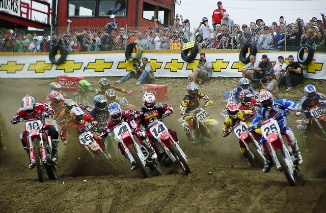 Southwick start - 2003 The start of one of the first 250 moto at the Southwick National in June of 2003. Nathan Ramsey (No. 25) has the holeshot, just ahead of Ricky Carmichael (No. 4) and Kevin Windham (No. 14). Also in the photo are Larry Ward (No. 10), John Dowd (No. 16) and Ernesto Fonseca (No. 24). In the background you can also see Jamie Brockman (No. 322) and Joaquim Rodrigues (No. 108). (Larry Lawrence photo)