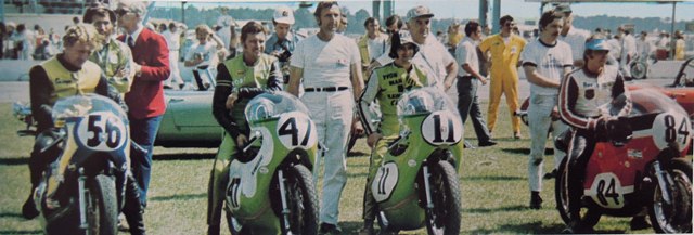 Kawasaki H1R 1971 Daytona Three of Kawasaki’s top hopes for the 1971 Daytona 200 line up for a photo before the race. The riders are New Zealand’s Ginger Molloy (No. 56), Ralph White (No. 47) and Canadian Yvon Du Hamel (No. 11). On the far right is Rex Beauchamp, a Harley-Davidson rider. (Courtesy DIS)