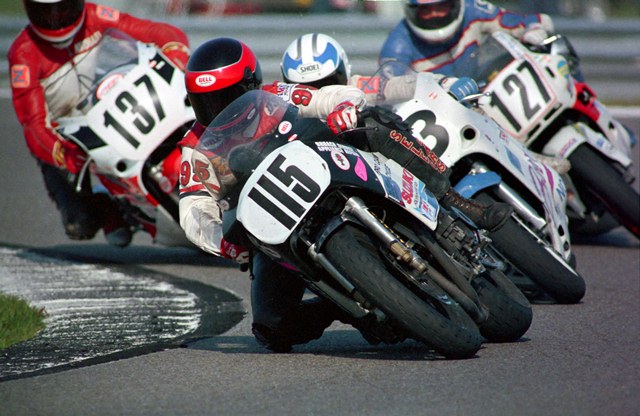 Norfleet, Billy - Daytona '90 Billy Norfleet, of Mechanicsville, Va., leads a tightly-packed group of riders in the 1990 Daytona 750 Supersport race. Tucking right in behind Norfleet are Minnesotan Mike Moores, Canadian Chuck Downie (No. 127), who I believe was racing a Honda CBR600 in the 750 class, and up-and-coming Texan Michael Martin. (Larry Lawrence photo)