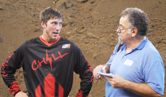 Matt Schneider talks with Steve Page of the Martinsville Reporter-Times during media day at Lucas Oil Stadium. (Larry Lawrence photo)
