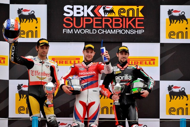 Race Two winner Jonathan Rea (center) shares the podium with second-place Sylvain Guintoli (left) and Eugene Laverty who finished third.
