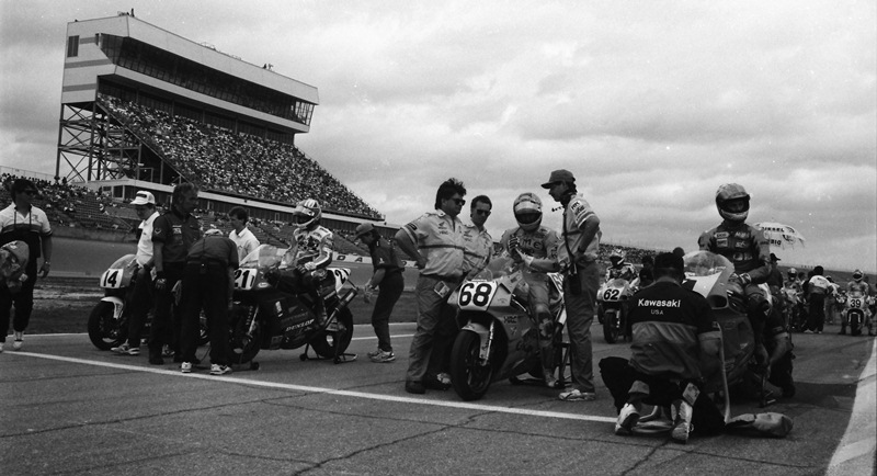 Daytona 200 front row - '93 The front row readies for the start of the 1993 Daytona 200 by Arai. On the far right is pole winner Scott Russell on the Muzzy Kawasaki. The other front-row starters included Camel Honda’s Mike Smith (No. 68), Fast by Ferracci Ducati’s Pascal Picotte (No. 21) and maybe a surprise front-row qualifier Steve Crevier on what I believe was a Canadian factory support Kawasaki. (Larry Lawrence photo)