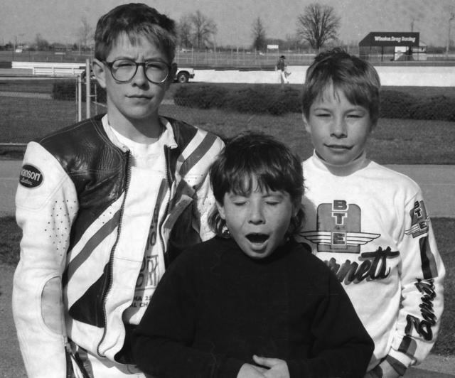 Haydens - IRP '93 The racing Hayden brothers, (l to r) Tommy, Roger Lee and Nicky, pose for a photo at a WERA race at Indianapolis Raceway Park in April of 1993. Tommy won three sprint races at IRP that day, Nicky won a race too. Roger Lee wasn't yet road racing full-sized bikes at this point. It looks like I hit the shutter just as roger was yawning or getting ready to say something. (Larry Lawrence photo)