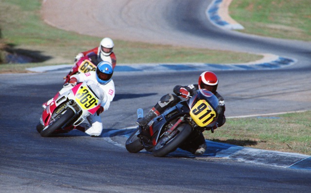 Dean Hayes leads Robert Haines (No. 369) and Russell Thornley (No. 880) at Road Atlanta in the WERA C Superbike Novice final at the 1990 GNF. This was a memorable race because Hayes took to the dirt to pass Haines for the lead. (Larry Lawrence photo)