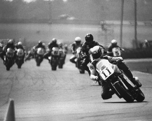 Hernon - Daytona '85 Pat Hernon, riding a Honda VF750, leads a group of riders into the International Horseshoe during the 1985 Daytona 200. That was the first year the 200 was a Superbike race. (Courtesy DIS)