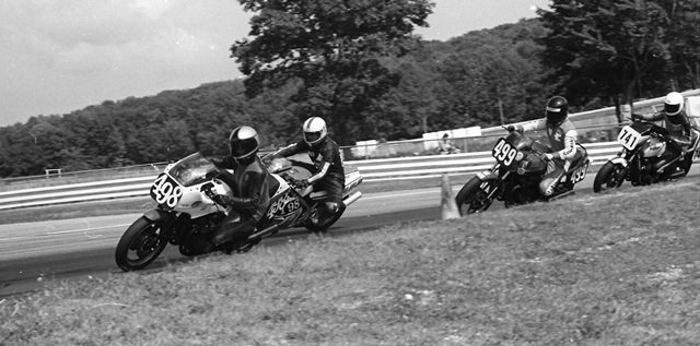 Hessel - Elkhart '84 Ed Hessel, on the No. 498 Kawasaki GPz750, leads a pack of riders in a WERA B Superbike race at Road America. In the photo with Hessel is an unidentified rider on the No. 198 Yamaha RZ500, Kurt Hall (No. 499 Kawasaki GPz550) and Charlie Buse (No. 741) on what I think is a Suzuki GS550E. (Larry Lawrence photo)