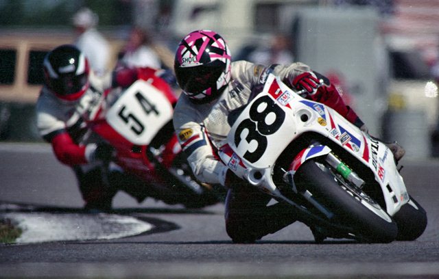 Hunt, Kevin - 1991 Daytona-sm South Carolinian Kevin Hunt races his Stokes Saab/Lockhart Racing Suzuki GSXR750 ahead of Chip Terrell in the 1991 Daytona 200. Hunt was a leading club racer in the mid-1980s, winning an AMA/CCS National title in 1985. He later made occasional forays into pro racing through the mid-1990s. (Larry Lawrence photo)