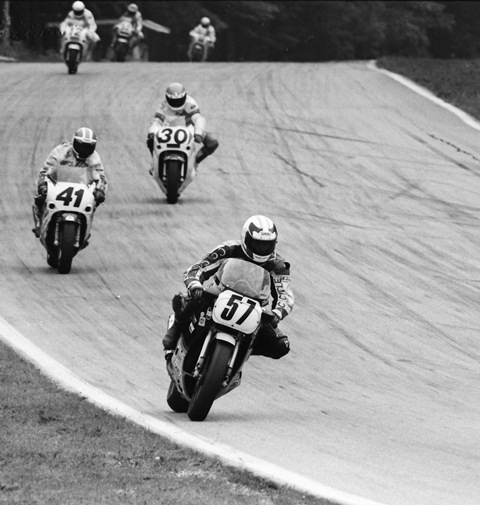 Moe, Eric - Elkhart 1989 Eric Moe (No. 57) races his Suzuki GSXR750 into Road America’s turn five during the AMA Superbike race there in June of 1989. Moe is leading a group of talented riders that includes Carry Andrew (No. 41) and John Eidenberger (No. 30). Moe was en route to what would prove to be his best career AMA Superbike finish. (Larry Lawrence photo)