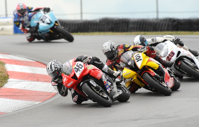 Tyler Odom, on the Don Odom Racing Honda CBR600RR, leads Marcos Reichert on the No. 101 RockwallPerformance.com Yamaha YZF-R6, Barrett Long aboard the No. 29 Longevity Racing Ducati 848 and Dane Westby on his No. 213 Westby Racing/Kneedraggers.com Yamaha YZF-R6 in the Sunday Daytona SportBike race at Mid-Ohio Sports Car Course on July 19, 2009. (Larry Lawrence photo)