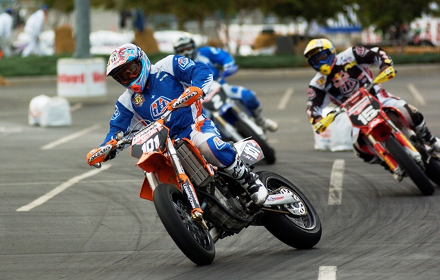 David Pingree, on his Red Baron Racing KTM, leads Cassidy Anderson (No. 15 Team Troy Lee Designs Honda) and Brandon Currie (No. 2 Graves Motorsports Yamaha) in the AMA Hot Wheels Supermoto Lites race in the parking lot of Denver’s Mile High Stadium on August 25, 2006. (Larry Lawrence photo)