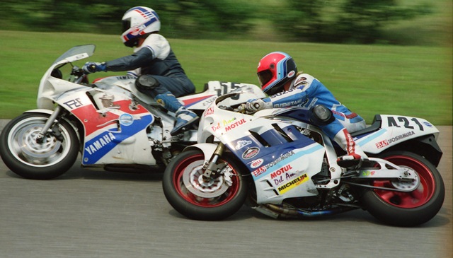 Springsteen - Grattan 7-90 Three-time AMA Grand National Champion Jay Springsteen races around the outside of another competitor during a Kerker/SBS WERA National Endurance race at Grattan Raceway on July 28, 1990. “Springer” was racing for a team called American Eagle with Fritz Kling and Ray Yoder teaming with the flat track legend. (Larry Lawrence photo)