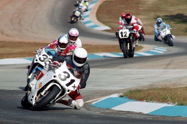 Abbott, Greg - GNF '91 Texan Greg Abbott leads Bruce Baldus and Tray Batey in what probably is the Suzuki GSXR1100 Cup Final at the 1991 WERA Grand National Final. Abbott had some tough luck in the Suzuki Cup Final, but won the A Production Championship and then finished second to Thomas Wilson in the Formula Open class to score a successful weekend at the GNF. (Larry Lawrence photo)