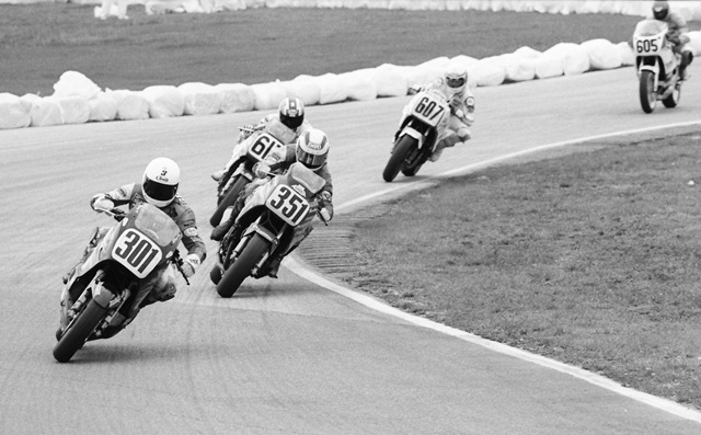 Graham, Ricky - Daytona '87 AMA Grand National flat track racers Ricky Graham (No. 301) and Rodney Farris (No. 351) lead a group of European riders in the 1987 Daytona 200. Graham and Farris lead Brits Geoff Fowler (No. 617) and Roger Hurst (No. 607) and German Michael Galinski (No. 605). (Larry Lawrence photo)