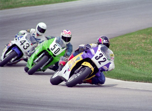 Tillman, Tim - Putnam '94 Tim Tillman, on his No. 32 Cycle Racer-sponsored Honda CBR600F2, leads Mike Reed (No. 50 Kawasaki ZX-6) and Ken Melville (No. 43 Honda CBR600F2) in the WERA National Challenge Series Michelin 600cc Superstock race at Putnam Park Road Course in July of 1994. (Larry Lawrence photo)