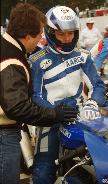 Yates - GNF '93 Aaron Yates gets a last-minute pep talk and perhaps some advice from his manager Cliff Nobles before the start of the 750cc class of the Suzuki GSXR Cup Final at the WERA GNF at Road Atlanta in 1993. (Larry Lawrence photo)